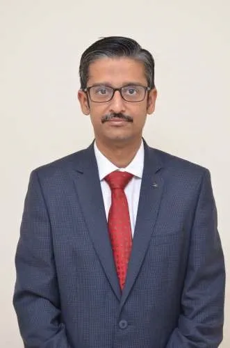 Dr. Raja Dhar